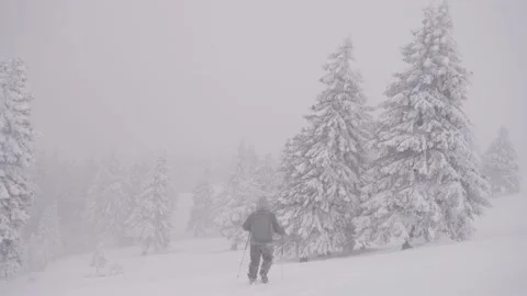 Professional photographer with backpack during severe snow storm Stock Footage 151044528