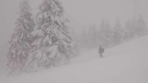 Professional photographer with backpack during severe snow storm Stock Footage 151044556