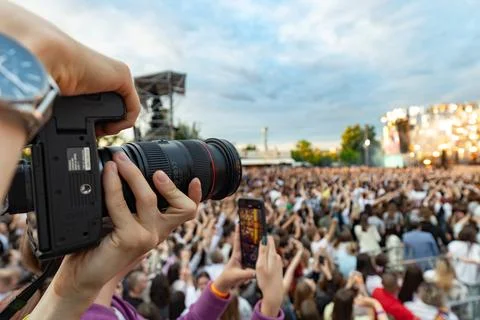 Professional Photographer Capturing Large Open Air Concert Crowd Stock Photos