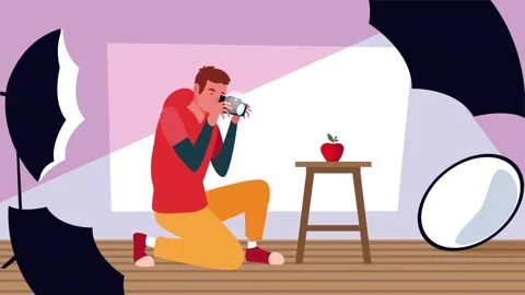 Professional photographer kneeling in studio taking photo of red apple on s.. Stock Footage 338403466