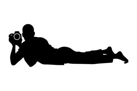 Professional photographer lying on ground capturing low angle shot 스톡 일러스트