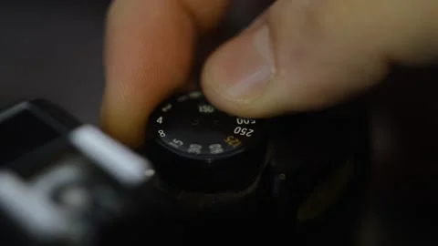 Professional photographer set reflex camera shutter speed for photo session. Stock-Footage 234290454