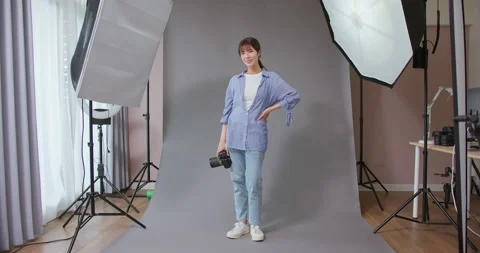 Professional photographer in studio Stock Footage 228408353