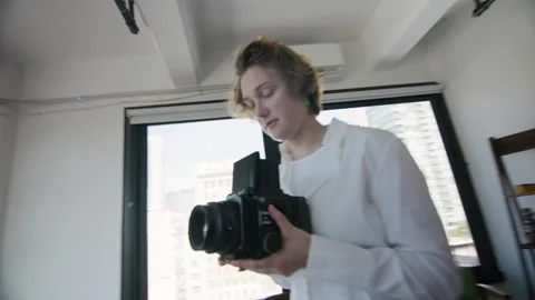 Professional photographer using vintage camera Stock Footage 197360991