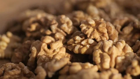 Professional photographs of walnuts up close, emphasizing their texture and Stock Footage 276600419