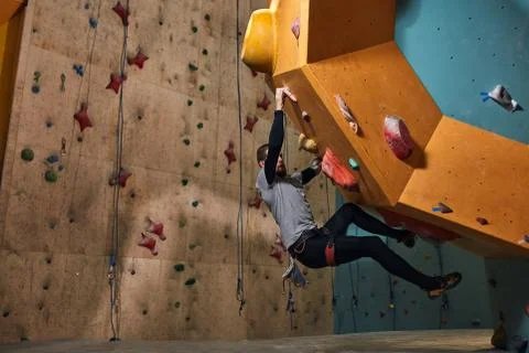 Professional physically challenged boulderer training hard after warming up Stock Photos