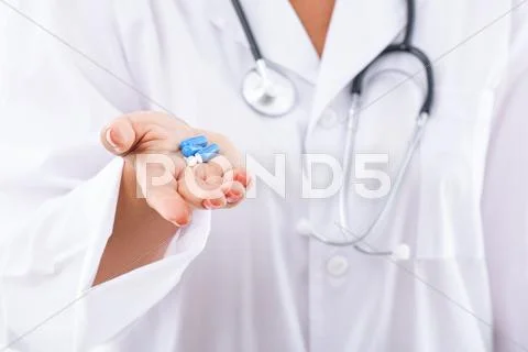 Professional physician presenting new medication Stock Photos