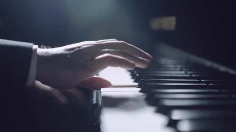 Professional pianist. The pianist performs playing a grand piano. Hands close up Stock Footage