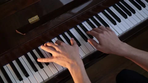 Professional pianist playing complex melody, highlighting precise hand Stock Footage 343847397