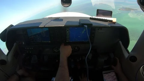 Professional pilot is flying high in the sky, pressing buttons on the dashboard Stock Footage 149083258