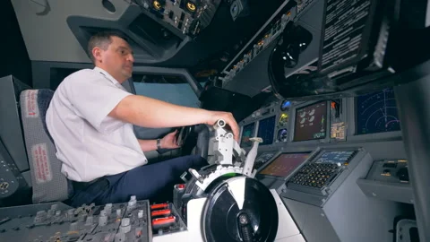 Professional pilot is moving a control wheel and a lever during the flight Stock Footage 90752414