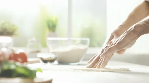 Professional pizza maker stretching the dough Stock Footage 127414096