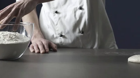 Professional pizza maker stretching the dough Stock Footage 127414345