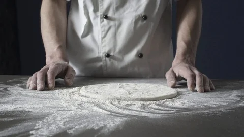 Professional pizza maker stretching the dough Stock Footage 127414407