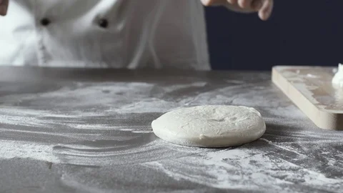 Professional pizza maker stretching the dough Stock Footage 127414767