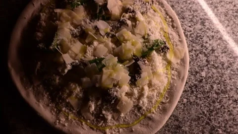 Professional pizzaiolo preparing and baking an artisan white pizza Stock Footage 327581140