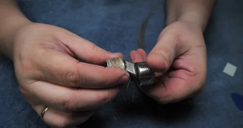 Professional plumbers wrap metal pipe fittings with flax fiber or tow to ensure Stock Footage 325873475