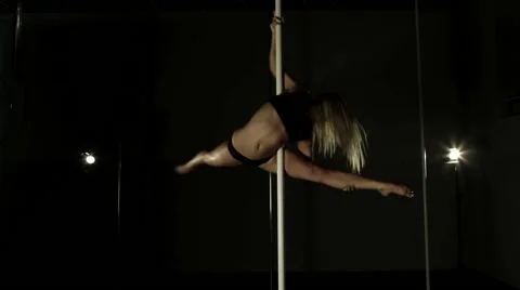 Professional Pole Dance. Young beautiful woman performs sensual dance. Stock Footage 66306166