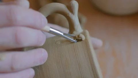 Professional potter making pattern on clay mug with special tool in workshop Stock Footage 101007670
