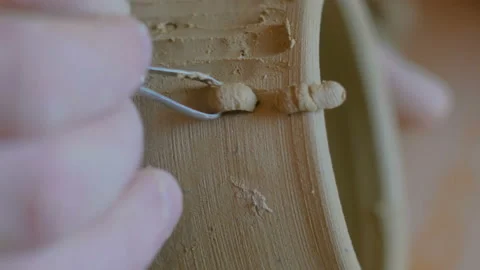 Professional potter making pattern on clay mug with special tool in workshop Stock Footage 106323153
