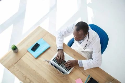 Professional practitioner working at laptop Stock Photos