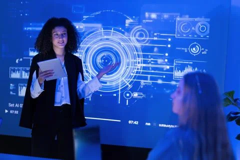 Professional presentation in a modern office setting with high-tech visuals.. Stock Photos