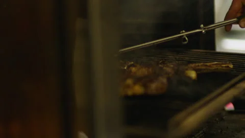 The professional process of cooking meat on the grill. Видео 232562603