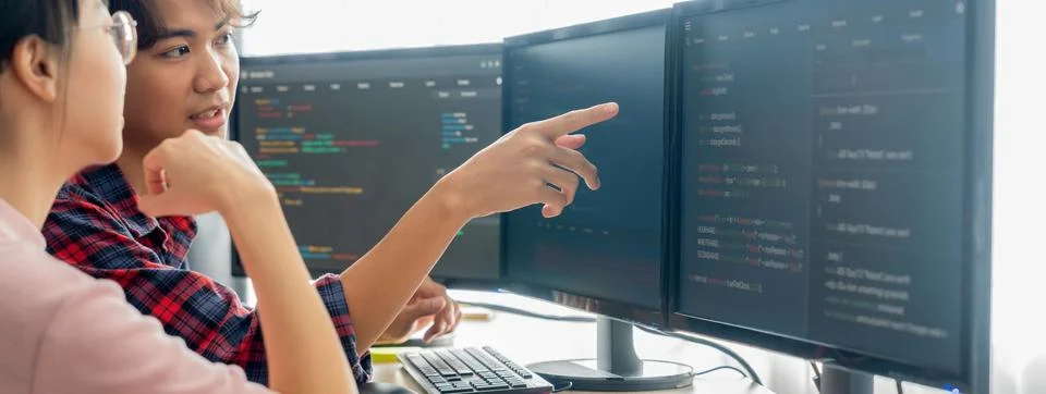 Professional programer team discuss about web coding at office. Burgeoning. Stock Photos