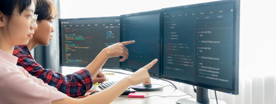 Professional programer team discuss about web coding at office. Burgeoning. Stock Photos