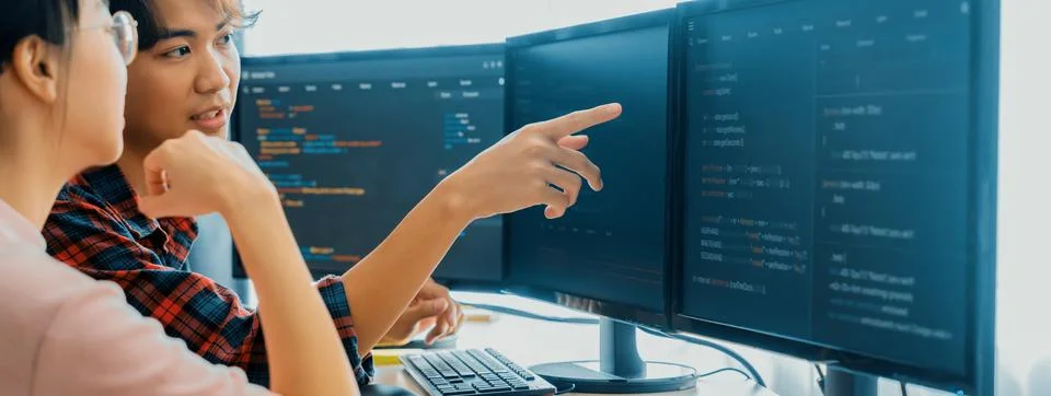 Professional programer team discuss about web coding at office. Burgeoning. Stock Photos
