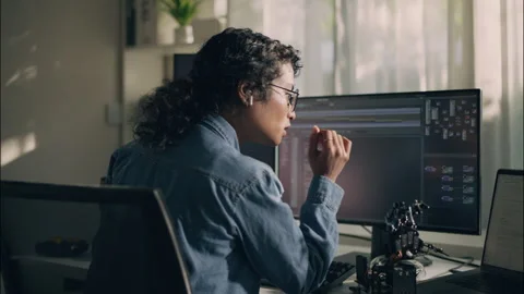 Professional programmer female engineer wearing glasses and Earbuds. Stock Footage 319001279