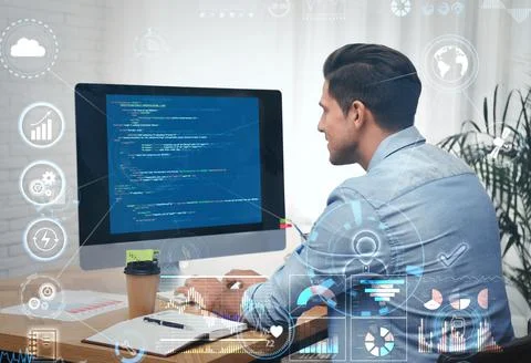 Professional programmer working with computer in office Stock-Fotos