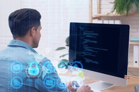 Professional programmer working with computer in office Stock-Fotos