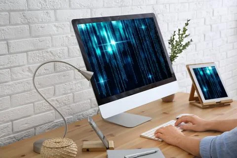 Professional programmer working with computer in office, closeup Foto stock