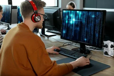 Professional programmer working with computer in office Stock Photos