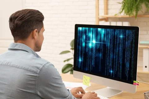 Professional programmer working with computer in office Foto stock