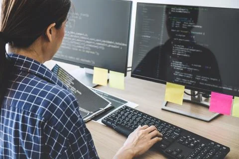 Professional programmer working at developing programming and website working Stock Photos