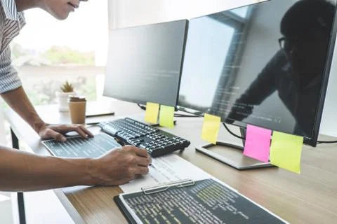 Professional programmer working at developing programming and website working Stock Photos