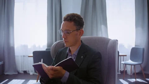 Professional psychologist writing notes during a therapy session Stock Footage 339614631