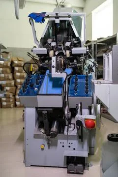 Professional pulling over lasting machine at shoe factory Stock Photos