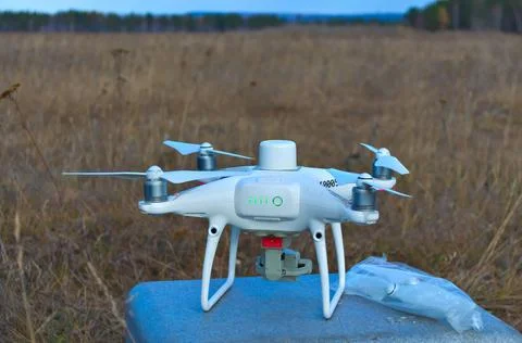 Professional quadcopter with high resolution camera onboard doing its job 库存照片