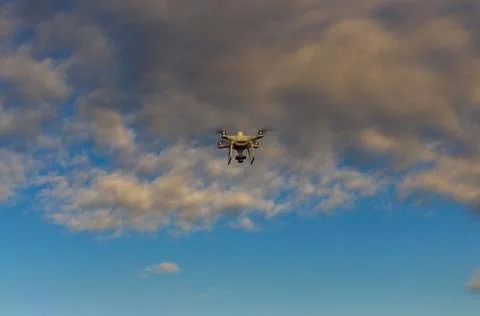 Professional quadcopter with high resolution camera onboard doing its job Stock Photos