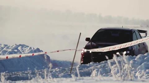 Professional rally racer turning car with cool drift making snow fog 库存影片 59651247