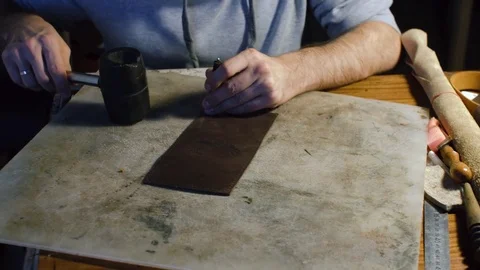 A professional re-enactment craftsman making leather item Stock Footage 71390452