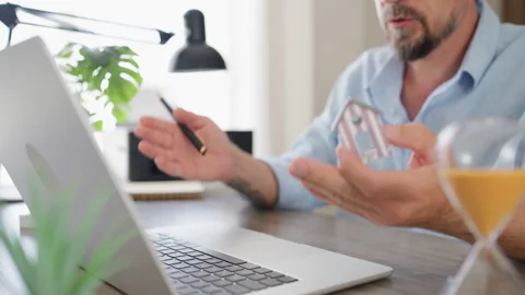 Professional real estate consultant explaining property options with a mini.. Stock Footage 341624969