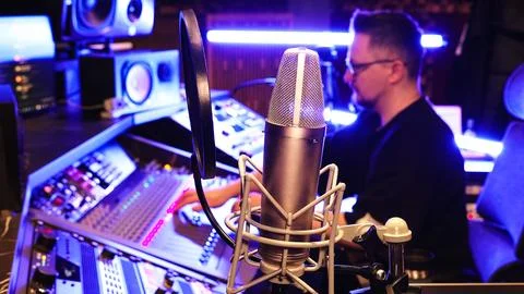 Professional Recording Studio With Microphone And Sound Engineer Producing Music Stock Photos