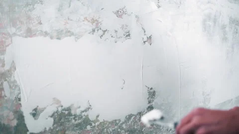 Professional repairman plastering wall, using spatula Stock-Footage 212757029