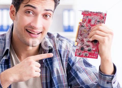 Professional repairman repairing computer in workshop Stock Photos