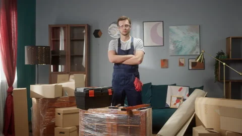 Professional repairman worker with tool box and gloves is waiting in apartments Stock Footage 149677269