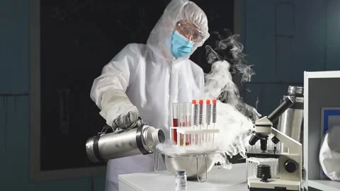 Professional researcher is doing experiment with smoke on a table of a chemical Stock Footage 145221490